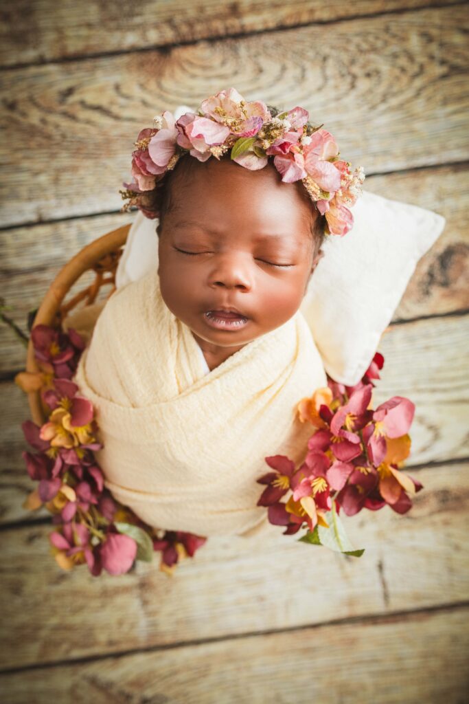 newborn girl in the small chair